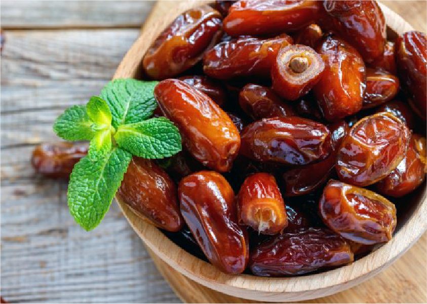 Fresh dates on palm tree